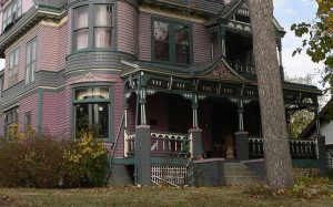 The lower half of the posts on this Queen Anne were replaced with brick piers for a subtle yet stylish update, probably in the 1920's. The brick has since been painted.