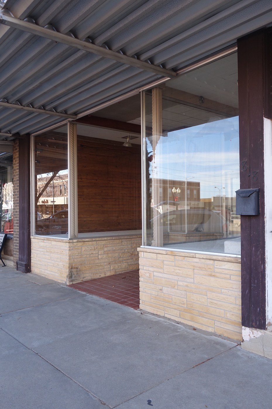 The plate glass display windows probably date to the 1950's.